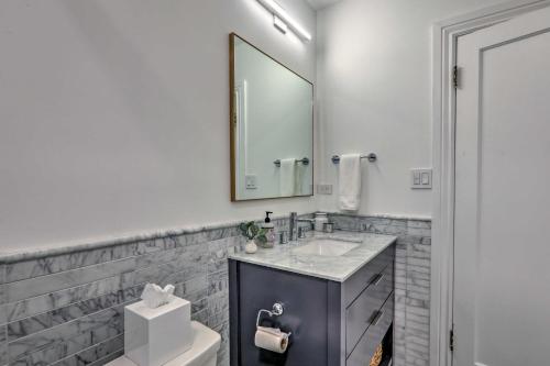 a bathroom with a sink and a mirror at Reno Home Less Than 1 Mile to Midtown and Truckee River in Reno