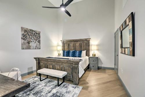 a bedroom with a bed and a ceiling fan at Modern Downtown Birmingham Condo with Rooftop Access in Birmingham