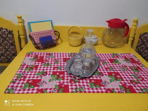 a table with a table cloth on top of a table at Apartman Tara in Vrdnik