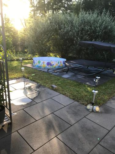 a picnic table with a dog bed on the grass at Jeannette in Balingen