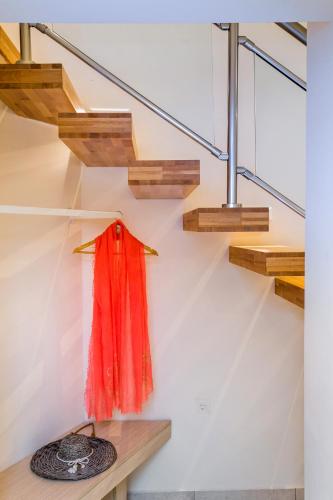 a room with a red scarf hanging on a wall at Estian Deluxe in Limenaria