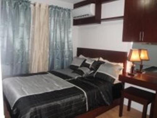 Postel nebo postele na pokoji v ubytování The Oasis Davao Condotel