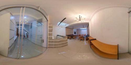 a hallway with a staircase and a stair case at Basadre Apart Hotel in Tacna