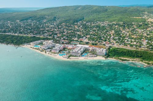 an aerial view of a resort on a beach at JOIA Rose Hall by Iberostar - Adults Only All Inclusive Resort in Montego Bay