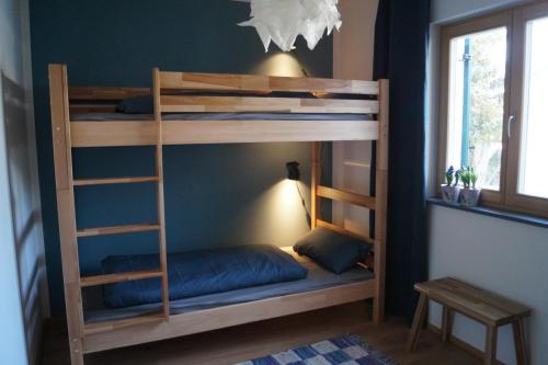 a bunk bed in a room with a bed in a room at Ferienhaus Inntal in Kiefersfelden