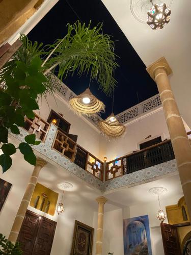a building with a ceiling with plants on it at RIAD Dar Ouezzani in Rabat