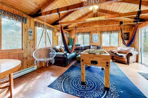 a living room with a couch and a table at Alpen Suite in Ossippee in Ossipee