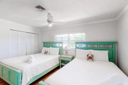 Katil atau katil-katil dalam bilik di Beach Villa 1B