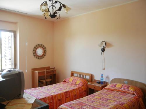 Postel nebo postele na pokoji v ubytování B&B La Pineta