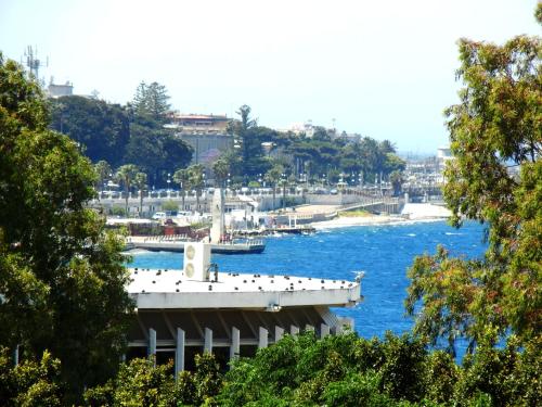 a bridge over a river with boats in the water at B&B La Pineta in Reggio Calabria