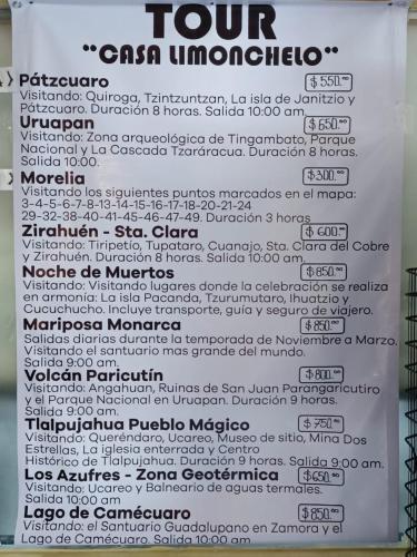 a white sign with a bunch of words on it at Casa Limonchelo Hotel B&B in Morelia