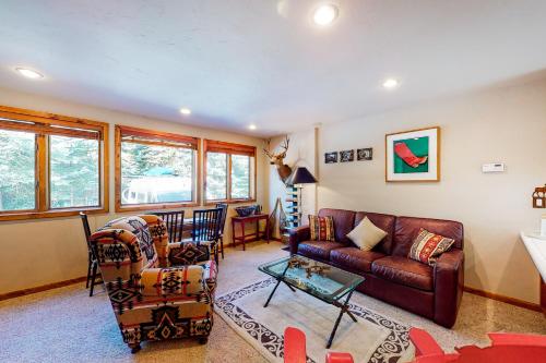 a living room with a couch and a table at Warm Springs Wonder in Ketchum