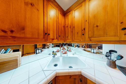 a kitchen with a large sink and wooden cabinets at Warm Springs Wonder in Ketchum