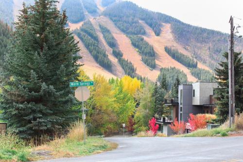 a street sign on the side of a road with a mountain at Warm Springs Wonder in Ketchum