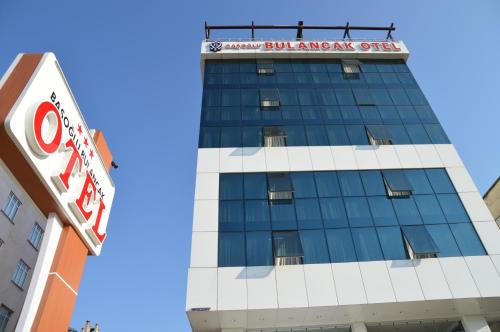 a building with a sign on top of it at Basoglu Bulancak Hotel in Bulancak