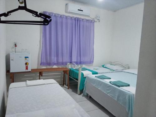Postel nebo postele na pokoji v ubytování Chacara Cabana dos Lagos
