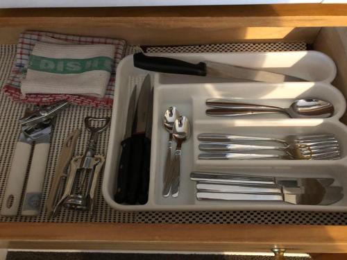 a drawer with a tray with utensils in it at Cozy 1BR stay in Taupo Central in Taupo