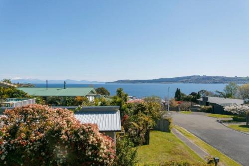 arial view of a town with a large body of water at Cozy 1BR stay in Taupo Central in Taupo