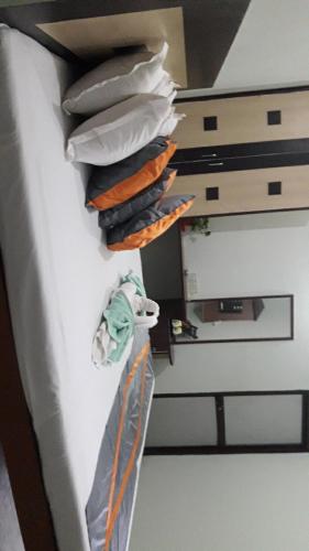 a bunch of bags hanging on a wall in a kitchen at Milan Palace Deoghar in Deoghar