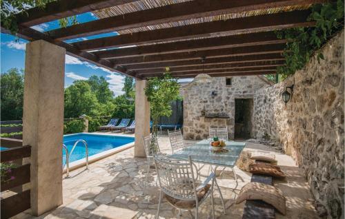 Four-Bedroom Holiday Home Zmijavci With A Fireplace 09