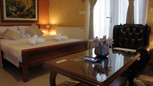 a hotel room with a bed and a coffee table at Apartments Dragović Nikšić in Nikšić