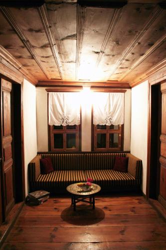 a living room with a couch and a table at Gulevi Safranbolu in Safranbolu