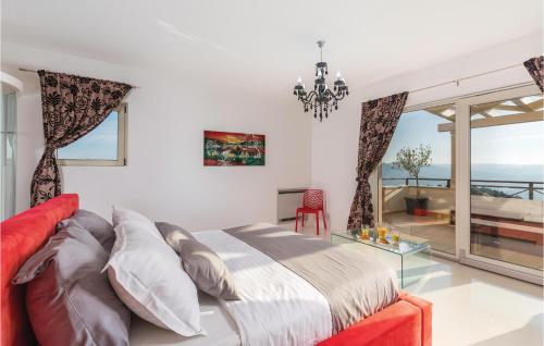 a bedroom with a bed and a view of the ocean at Amazing Home In Pasini With 4 Bedrooms, Internet And Outdoor Swimming Pool in Livade