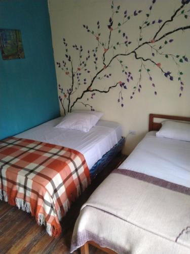 Cama o camas de una habitación en Buganvilla Guest House