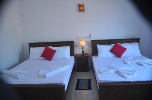 Postel nebo postele na pokoji v ubytování Nethum Beach House