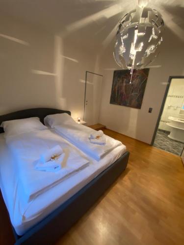 Кровать или кровати в номере Urban Living Graz - Apartment Top 4 self check-in