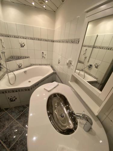 Ванная комната в Urban Living Graz - Apartment Top 4 self check-in