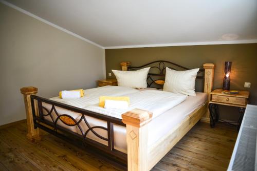 a bedroom with a large bed with white sheets at Apartment Central am Zoo in Leipzig