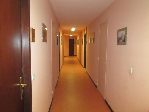 an empty hallway with a long corridor at Résidence Mer & Golf Sokoburu in Hendaye