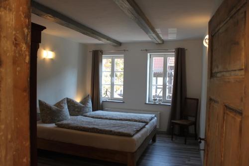 Postel nebo postele na pokoji v ubytování Apartments Ackerbürgerhof No. 9