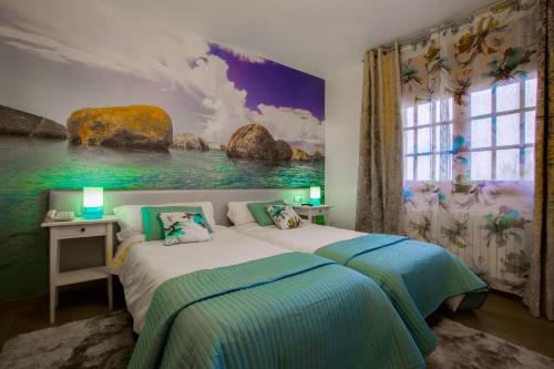 מיטה או מיטות בחדר ב-Hotel & Apartamentos Cons da Garda