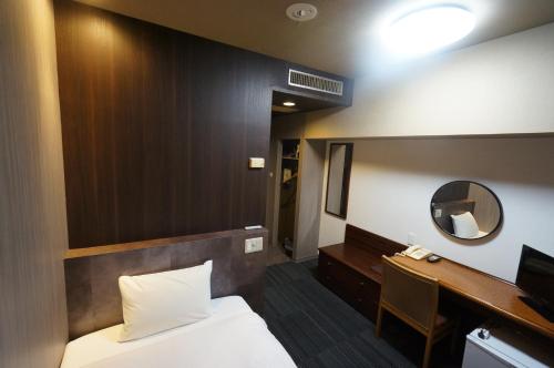 Postel nebo postele na pokoji v ubytování Hotel Areaone Minamisoma