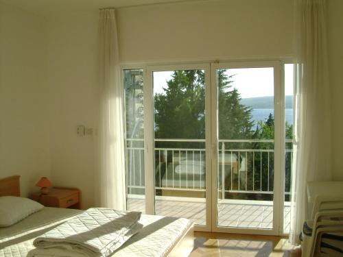 Posteľ alebo postele v izbe v ubytovaní Apartments Petricevic