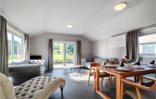 a living room with a couch and a table at Waterpark Giethoorn 2 in Giethoorn
