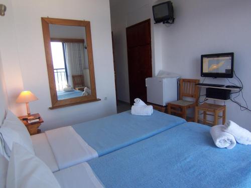Postel nebo postele na pokoji v ubytování Hotel Maria-Elena