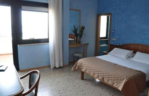 Ein Bett oder Betten in einem Zimmer der Unterkunft Hotel Maja