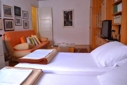 Кровать или кровати в номере Apartment Divina Ragusa