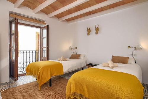 Postel nebo postele na pokoji v ubytování Casa En Grenyo, Javea