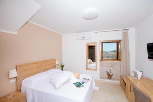 Postel nebo postele na pokoji v ubytování Hotel Punta San Francesco