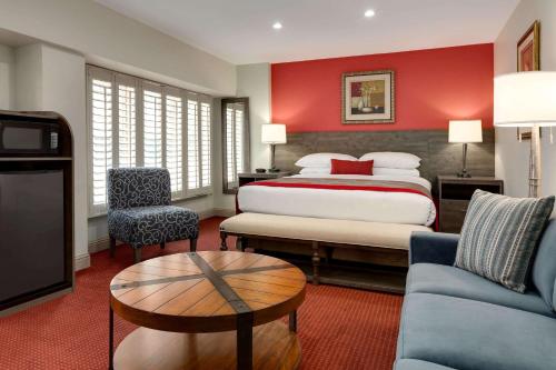 A bed or beds in a room at Ramada by Wyndham Oakland Downtown City Center