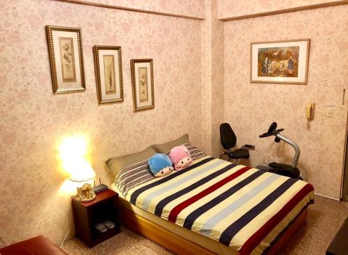 Ένα ή περισσότερα κρεβάτια σε δωμάτιο στο Hello B&B 預定後請主動連繫