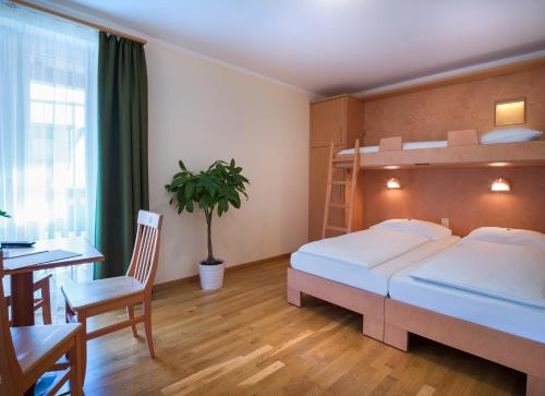Postel nebo postele na pokoji v ubytování JUFA Hotel Altaussee