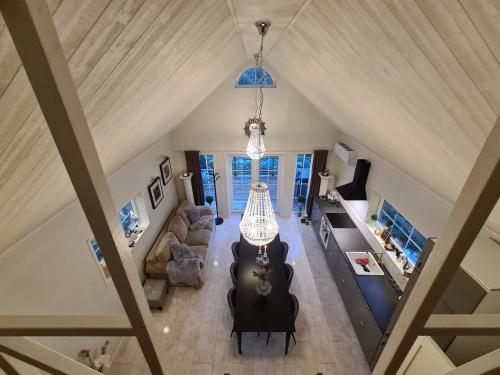 an overhead view of a living room with a chandelier at Tosthult Holiday in Lönsboda