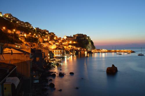 a view of a town at night with lights at B&B La Veduta in Scilla