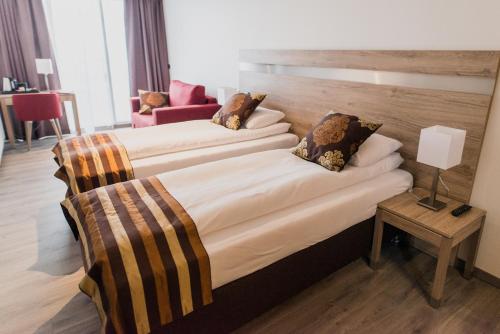 เตียงในห้องที่ Hotel Duus by Keflavik Airport