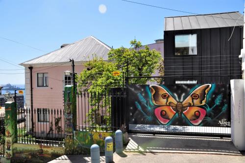 a mural of a butterfly on the side of a building at AYCA La Flora Hotel Boutique in Valparaíso